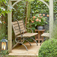 home backyard garden well designed with pathway bench trellis